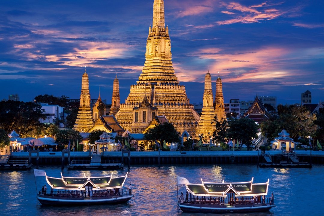 Wat Arun beside the Chao Phraya River in Bangkok